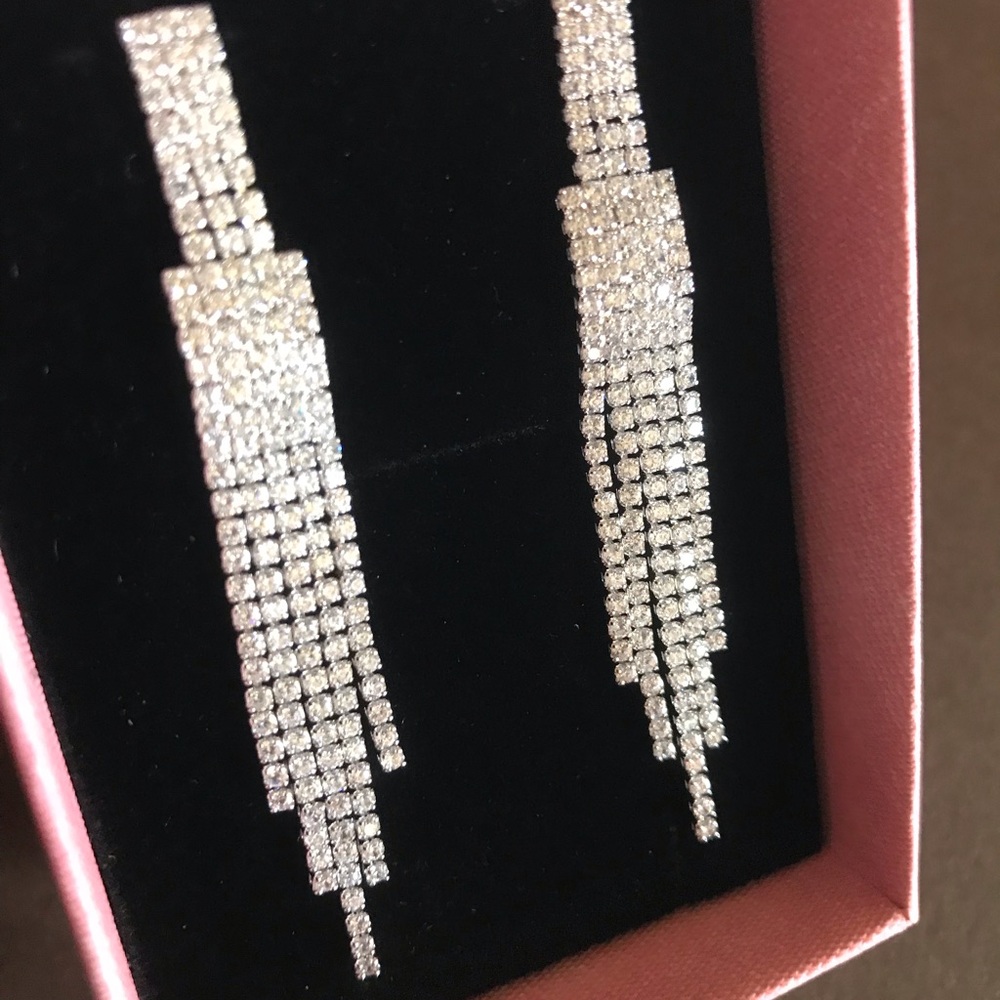 Sparkly dangling stud earrings with faux diamonds
